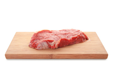 Wooden board with fresh raw meat on white background