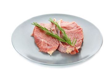 Plate with fresh raw meat, isolated on white