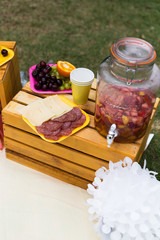 Decoration, lemonade jar, plate with fruits, plate with cheese and salami