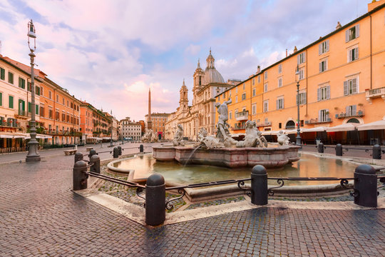 The Fountain of Neptune on the famous Piazza Navona Square at sunrise, Rome, Italy.