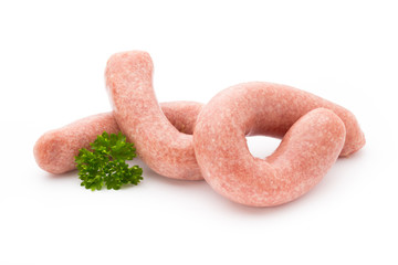 Raw sausages with herbs and spices.