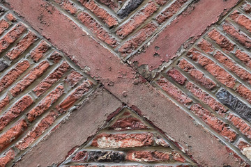 Old timber framed red brick wall ancient building style
