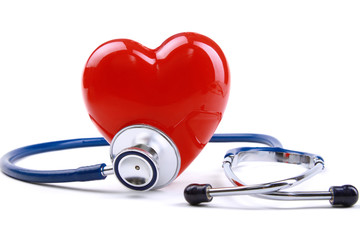 Red heart and a stethoscope on desk