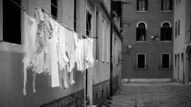 Black and white footage of the laundry drying on the ropes in Venice, Italy
