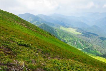 Fototapeta na wymiar Travel, trekking, nature. Majestic, high green mountains. Horizontal frame
