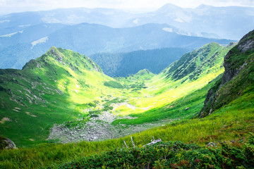 Travel, trekking, nature. Majestic, high green mountains. Horizontal frame