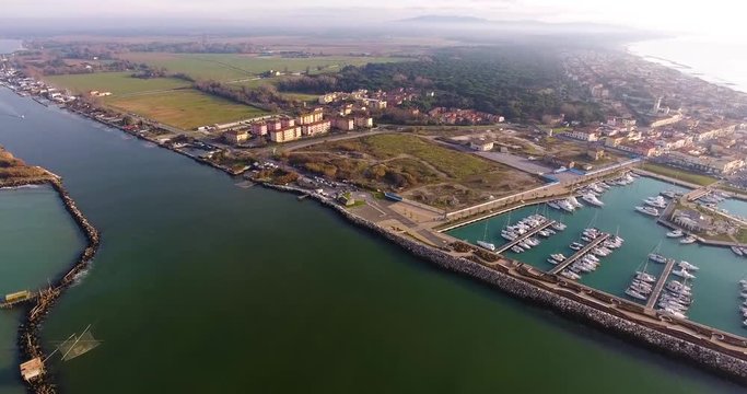 Aerial shot, small port in the winter sunset, in Pisa, Tuscany, Italy