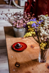 Vegan chocolate truffle on a red plate at coffee shop. Healthy raw energy bites. Vintage filter effect