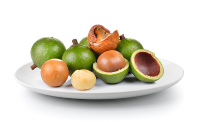 macadamia nut in a plate isolated on a white background