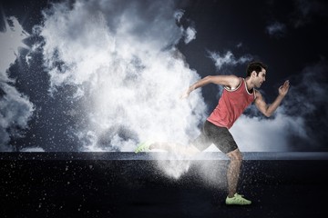 Fototapeta na wymiar Composite image of confident male athlete running from starting