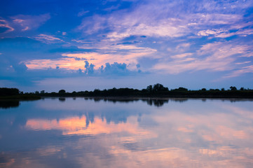 Naklejka premium Summer landscape: clouds before the water surface