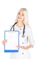 Smiling female doctor assistant scientist in white coat over white isolated background with black blank board