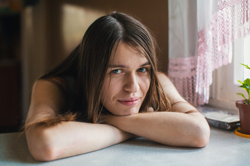 Portrait of beautiful young woman close-up in her home.