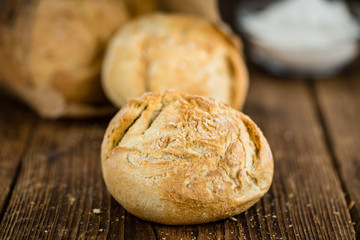 Wooden table with German Rolls, selective focus