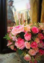 man look at mirror and pink rose