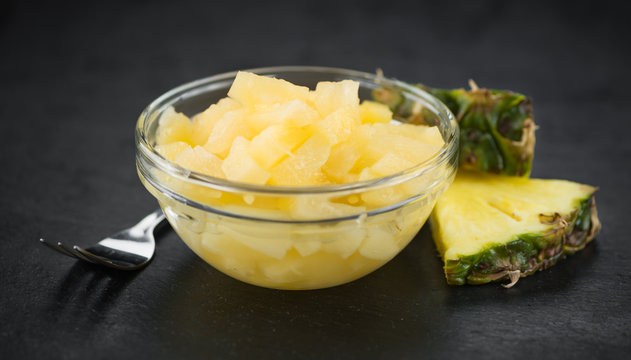 Rustic slate slab with Chopped Pineapple (preserved), selective focus