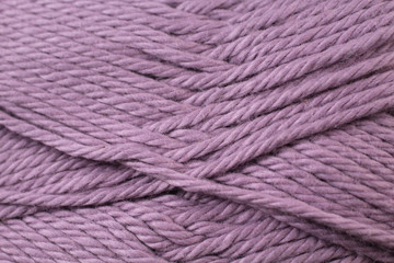 A super close up image of plum yarn