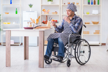 Young disabled husband preparing food salad