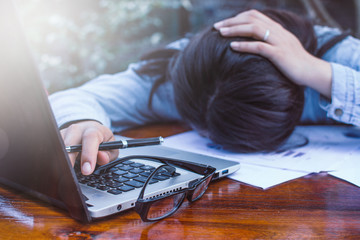 Stressed businesswoman having problems and headache at work