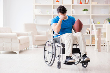 Fototapeta na wymiar Young man american football player recovering on wheelchair
