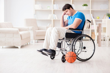 Fototapeta na wymiar Young basketball player on wheelchair recovering from injury