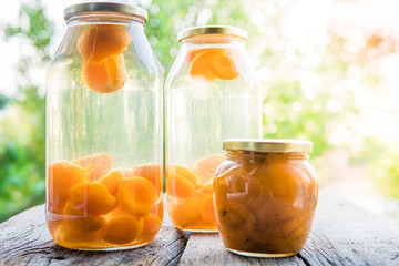 Apricot compote in a glass jar outdoor