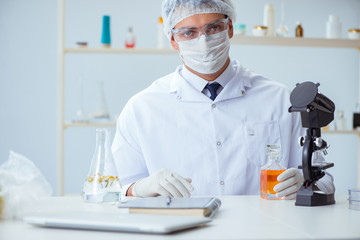 Chemist mixing perfumes in the lab