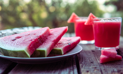 Watermelon juice on a wooden table. Rustic style