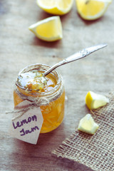 Homemade lemon jam in glass jar. Organic fresh yellow jam