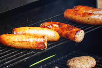 grilled sausage in a row for barbecue party