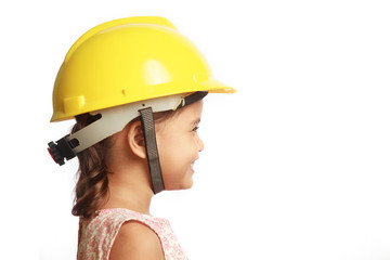 Little girl engineer on white background.