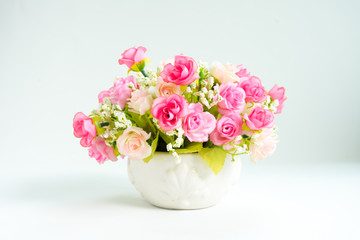 Rose fake flower and Floral background. rose flowers made of fabric. The fabric flowers bouquet. Colorful of decoration artificial flower, top view