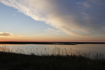 Beautiful sunset over an arctic landscape with clouds in the sky