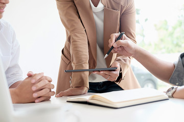 Attractive meeting at nonprofit boardroom group of employees at conference table workers collaborate in discussion