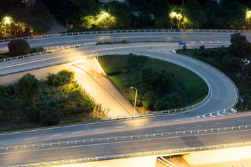 closeup of the light trails on grade separation bridge