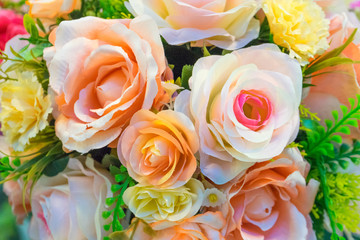 Rose fake flower and Floral background. rose flowers made of fabric. The fabric flowers bouquet. Colorful of decoration artificial flower