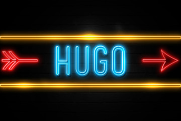 Hugo  - fluorescent Neon Sign on brickwall Front view