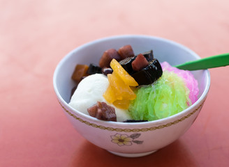 Ice cream and fruit and vermicelli.
