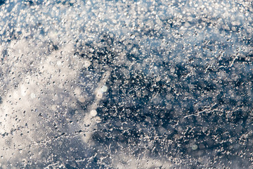 Abstract background of drops of water on the fly
