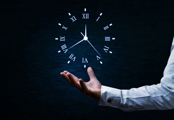 Businessman holding clock. Business time management .