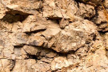 Stone cliffs in the mountains as a background