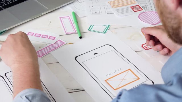 UX designer creating smartphone application layout