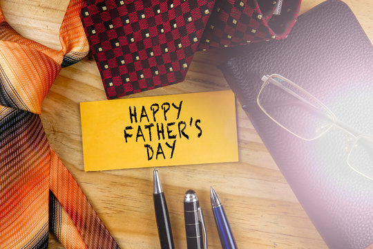 Tie,wallet,pen and yellow board. Happy Father's Day Concept