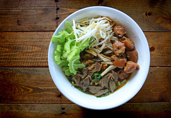 chicken noodle soup thai food tradition on old wood table