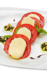 mozzarella with tomato and basil isolated on white