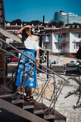 Young pretty woman on the pier near