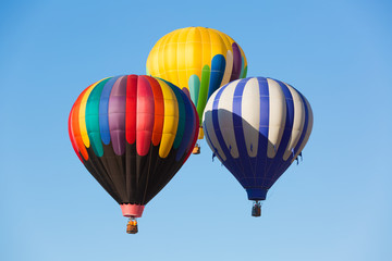 Naklejka premium Hot air balloons up in the blue sky