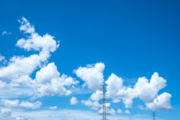 Beautiful blue sky and clouds with high voltage towers