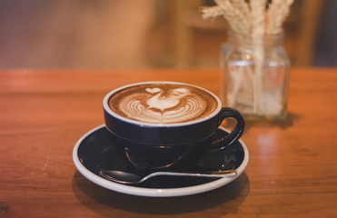 Coffee cup and coffee beans on table