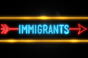 Immigrants  - fluorescent Neon Sign on brickwall Front view